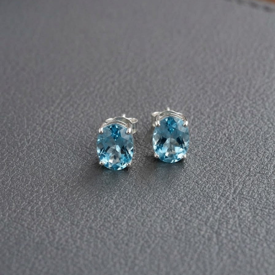 The Sterling Solitaire Blue Topaz Stud Earrings